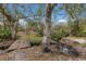 Rustic footbridge over a calm creek in a wooded area at 38355 State Road 64 E, Myakka City, FL 34251