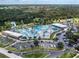 Large community pool complex with water park features, lap pool, and ample parking at 3972 Titan St, North Port, FL 34286