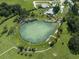 Aerial view of spring-fed swimming pool and surrounding park-like setting at 3972 Titan St, North Port, FL 34286