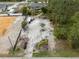 Aerial view of lot, showing potential for development with surrounding vegetation at 3972 Titan St, North Port, FL 34286