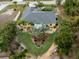 Aerial view of house with heart-shaped lawn and surrounding tropical landscape at 3972 Titan St, North Port, FL 34286