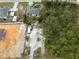 Aerial view of property showing a lot with a house and surrounding undeveloped land at 3972 Titan St, North Port, FL 34286