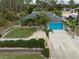 Single-story house with teal garage door and lush landscaping at 3972 Titan St, North Port, FL 34286