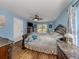 Serene bedroom with light blue walls and a comfortable bed at 3972 Titan St, North Port, FL 34286