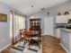 Charming dining room with hardwood floors and wood furniture at 3972 Titan St, North Port, FL 34286