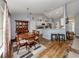 Well-lit dining area with hardwood floors and a kitchen view at 3972 Titan St, North Port, FL 34286