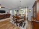 Bright dining area with hardwood floors and a wood table set at 3972 Titan St, North Port, FL 34286