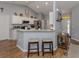 Kitchen with white cabinets, granite counters, and breakfast bar at 3972 Titan St, North Port, FL 34286