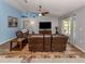 Spacious living room with hardwood floors, leather sofas and a large TV at 3972 Titan St, North Port, FL 34286