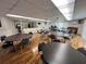 Bright community room, tables and kitchen at 4210 Ironwood Cir # 308J, Bradenton, FL 34209