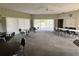 Community room with pool view and tables at 4210 Ironwood Cir # 308J, Bradenton, FL 34209