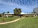 Community clubhouse with landscaped grounds at 4210 Ironwood Cir # 308J, Bradenton, FL 34209