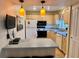 Small kitchen with light cabinets and modern appliances at 4210 Ironwood Cir # 308J, Bradenton, FL 34209
