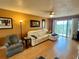 Living room with white leather couch and access to balcony at 4210 Ironwood Cir # 308J, Bradenton, FL 34209