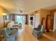 Living room with a white leather couch and two armchairs at 4210 Ironwood Cir # 308J, Bradenton, FL 34209