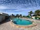 Community pool with plenty of lounge chairs at 4210 Ironwood Cir # 308J, Bradenton, FL 34209