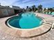 Relaxing kidney-shaped pool with lounge chairs at 4210 Ironwood Cir # 308J, Bradenton, FL 34209