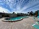 Inviting kidney-shaped pool, ample seating at 4210 Ironwood Cir # 308J, Bradenton, FL 34209