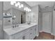 Updated bathroom featuring a double vanity and subway tile shower at 4310 Zenith Rd, Venice, FL 34293
