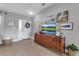 Bright entryway with wood flooring and mid-century furniture at 4310 Zenith Rd, Venice, FL 34293