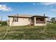 Back of house with screened porch and grassy yard at 4310 Zenith Rd, Venice, FL 34293
