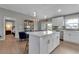 Modern kitchen with white cabinets, a stainless steel range, and herringbone backsplash at 4310 Zenith Rd, Venice, FL 34293