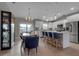 Modern kitchen with white cabinets, stainless steel appliances, and a large island at 4310 Zenith Rd, Venice, FL 34293