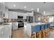 Modern kitchen with white cabinets, quartz countertops, and stainless steel appliances at 4310 Zenith Rd, Venice, FL 34293