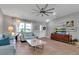 Living room with light blue sofas and wood flooring at 4310 Zenith Rd, Venice, FL 34293