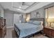 Large main bedroom featuring a barn door and stylish metal bed frame at 4310 Zenith Rd, Venice, FL 34293