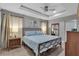 Spacious main bedroom with a ceiling fan and modern dresser at 4310 Zenith Rd, Venice, FL 34293