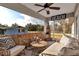 Relaxing screened porch with wicker furniture and a tropical vibe at 4310 Zenith Rd, Venice, FL 34293
