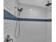Modern shower with subway tile and blue accents at 4310 Zenith Rd, Venice, FL 34293