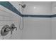 Modern shower with subway tile and blue accents at 4310 Zenith Rd, Venice, FL 34293