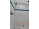 Modern shower with subway tile and hexagon floor at 4310 Zenith Rd, Venice, FL 34293