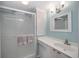 Clean bathroom with shower stall, vanity, and mirror at 4953 Sea Island Ave, Sarasota, FL 34234