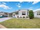 White single-wide mobile home with carport and landscaped lawn at 4953 Sea Island Ave, Sarasota, FL 34234