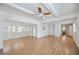 Bright and airy living room with laminate flooring and ceiling fan at 4953 Sea Island Ave, Sarasota, FL 34234
