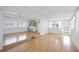 Open concept living and kitchen area with laminate floors and raised step at 4953 Sea Island Ave, Sarasota, FL 34234