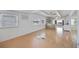 Open living space featuring laminate flooring and kitchen views at 4953 Sea Island Ave, Sarasota, FL 34234