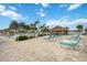 Relaxing pool deck with lounge chairs and tiki hut at 4953 Sea Island Ave, Sarasota, FL 34234