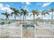 Community spa with palm trees and white fence at 4953 Sea Island Ave, Sarasota, FL 34234