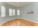 Light and airy bedroom with hardwood floors and window seating at 5023 Tobermory Way, Bradenton, FL 34211