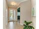 Bright and airy entryway with tile flooring and access to other rooms at 5023 Tobermory Way, Bradenton, FL 34211
