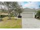 Single-story house with a two-car garage and landscaped yard at 5023 Tobermory Way, Bradenton, FL 34211