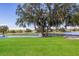 Picturesque golf course with a pond and lush greenery at 5023 Tobermory Way, Bradenton, FL 34211
