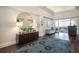 Hallway with decorative mirror and access to dining area at 5023 Tobermory Way, Bradenton, FL 34211