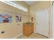 Convenient laundry room with sink and built-in shelving at 5023 Tobermory Way, Bradenton, FL 34211