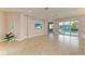 Open living room with pool view and access to other rooms at 5023 Tobermory Way, Bradenton, FL 34211