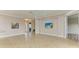 Open concept living space with kitchen and views to backyard at 5023 Tobermory Way, Bradenton, FL 34211